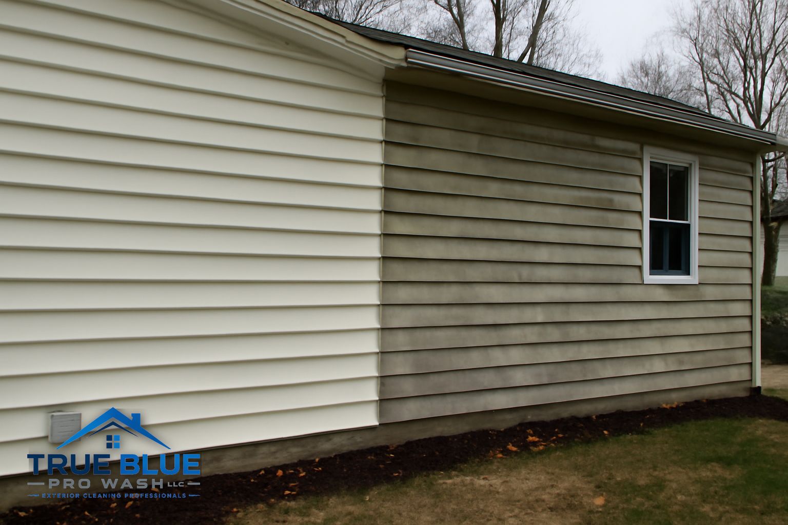 Before and after soft washing a commercial building exterior in 19317