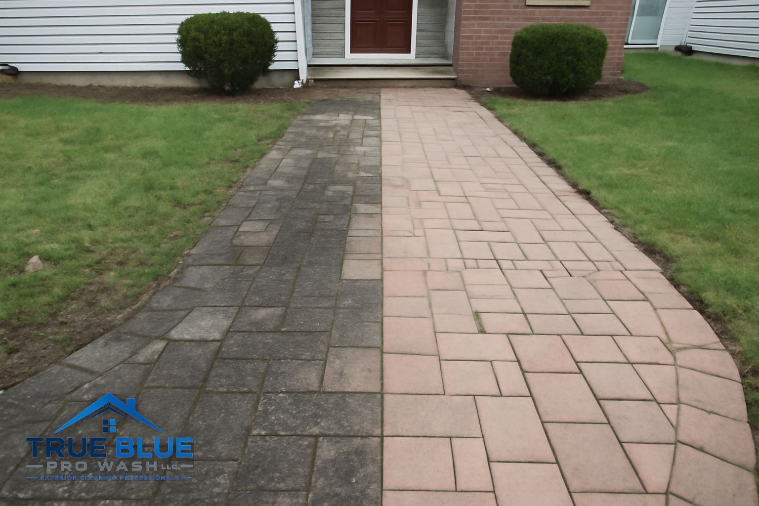 True Blue Pro Wash technician cleaning a residential paver walkway in Wilmington Delaware using controlled low-pressure rinse
