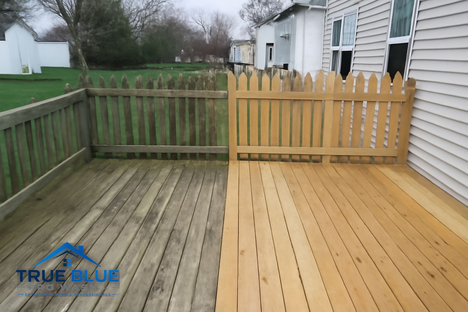 Technician soft washing a wood deck in New Castle, DE
