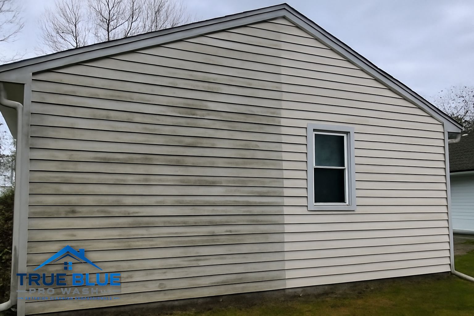 Soft washing a two-story vinyl sided home in New Castle County Delaware