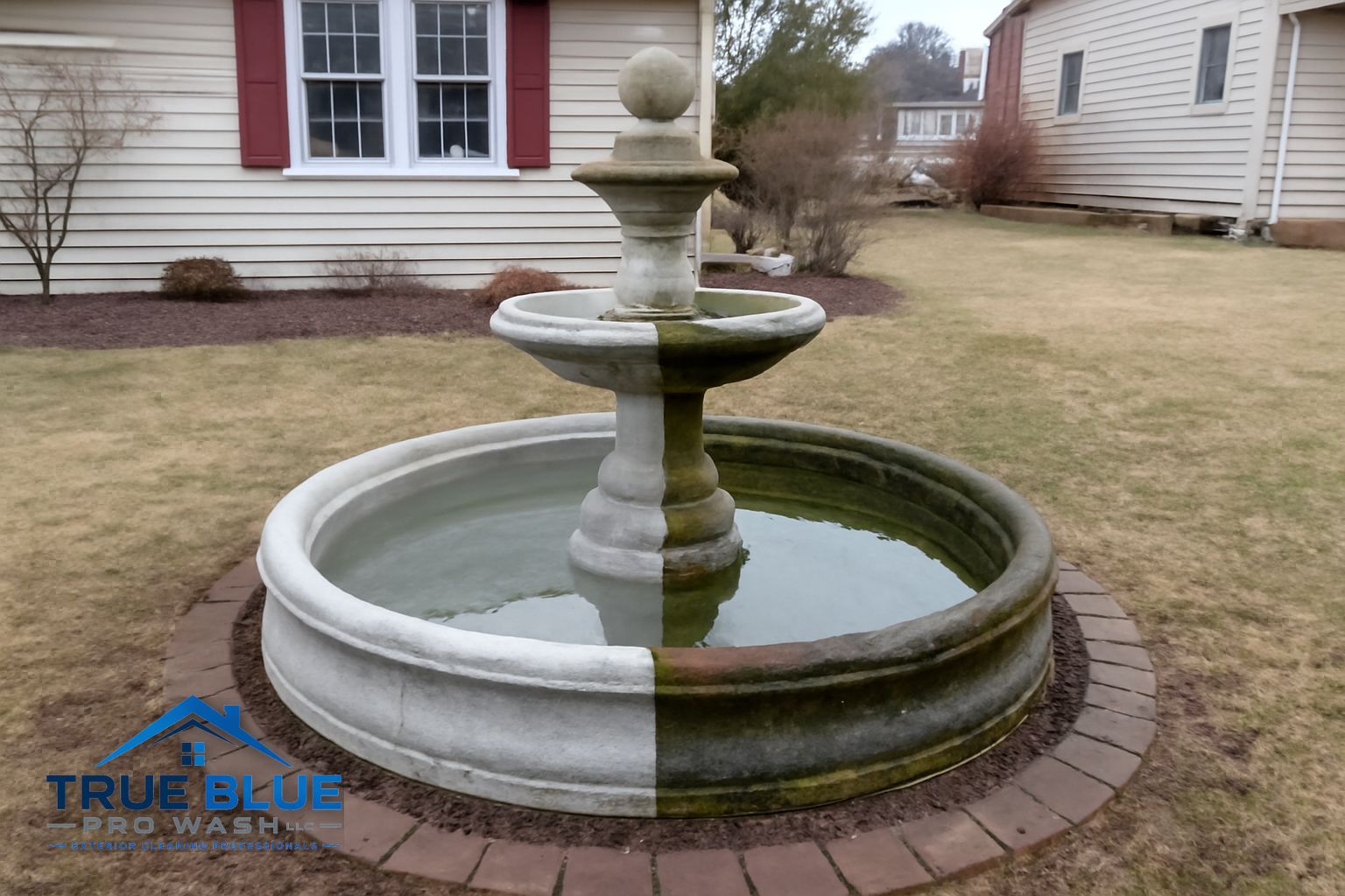Pressure washing technician cleaning stone fountain surround and hardscape in New Castle County DE