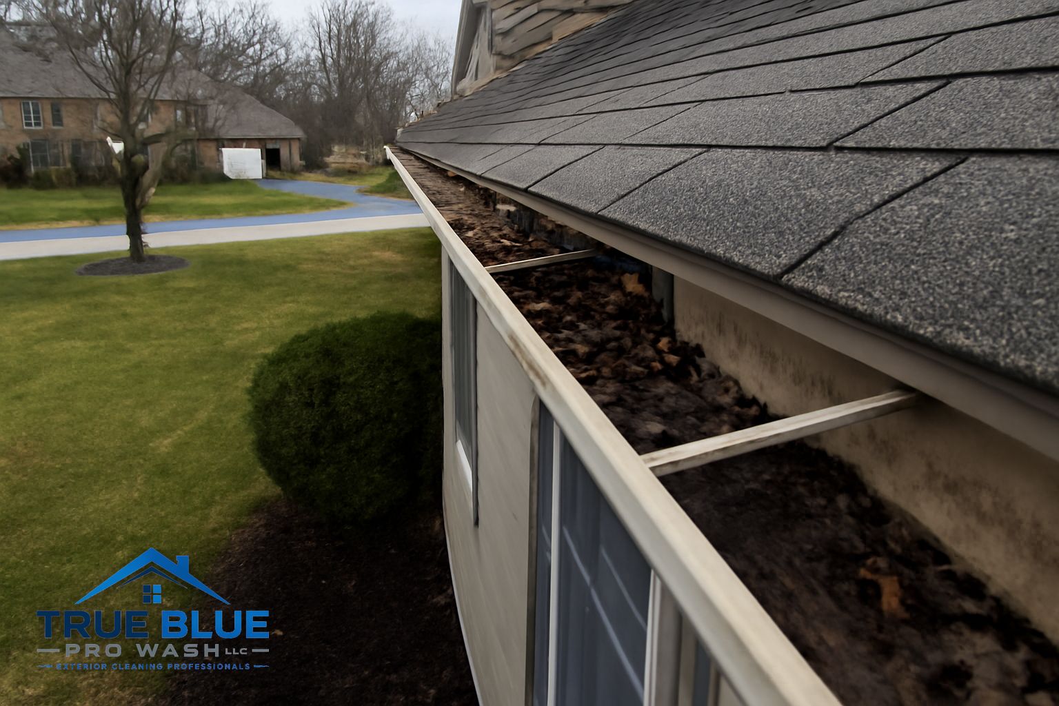 Close-up of resecured gutter hanger and cleaned aluminum trough on a Chester County PA home