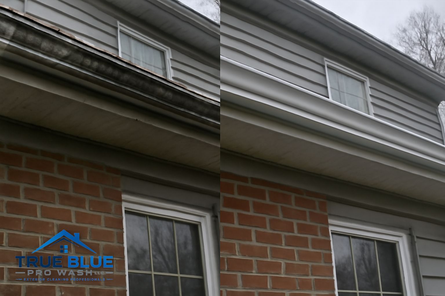 Technician flushing a downspout on a Wilmington colonial during gutter cleaning service