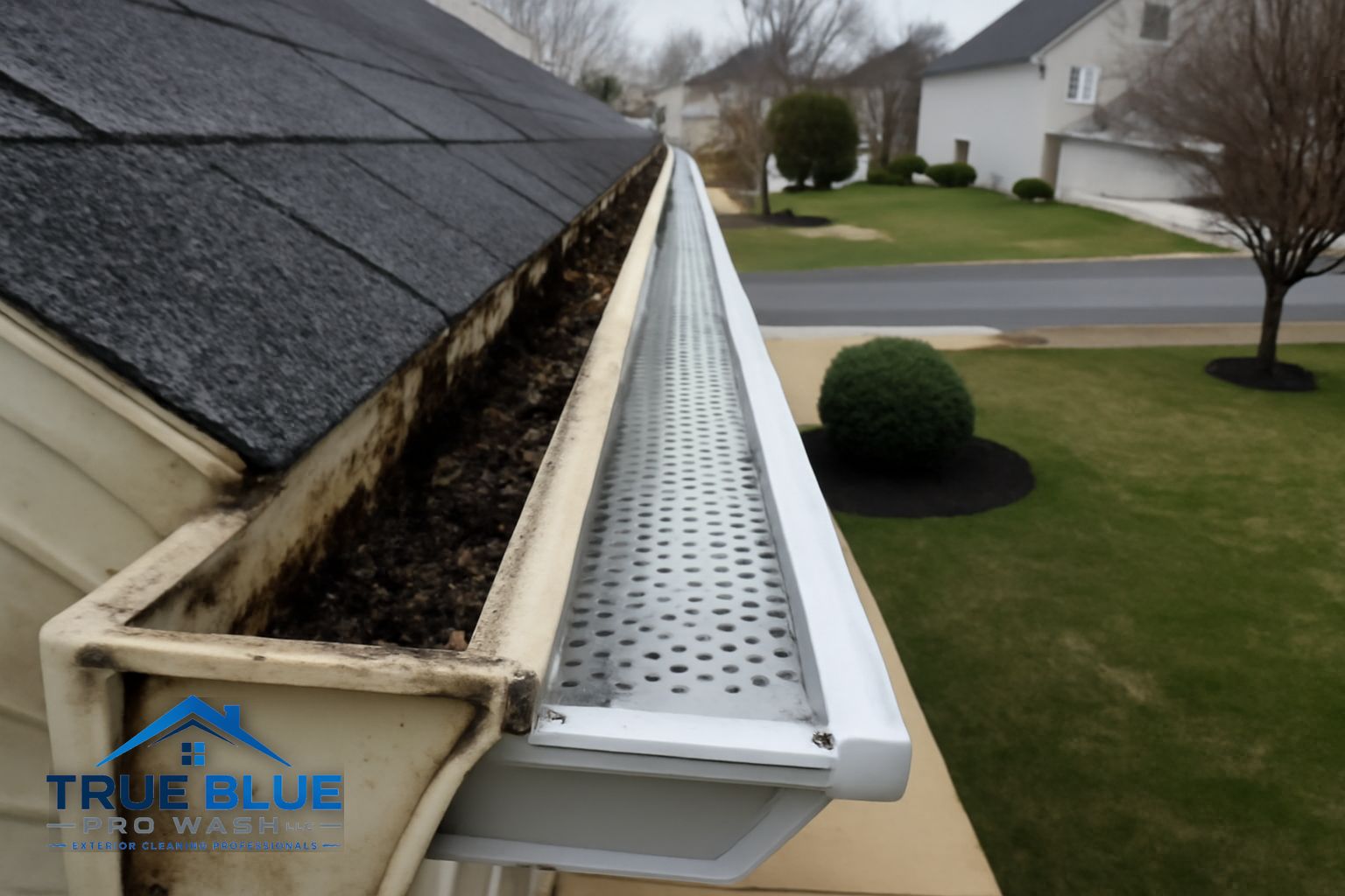 Technician flushing gutters on a two-story home in Middletown Delaware