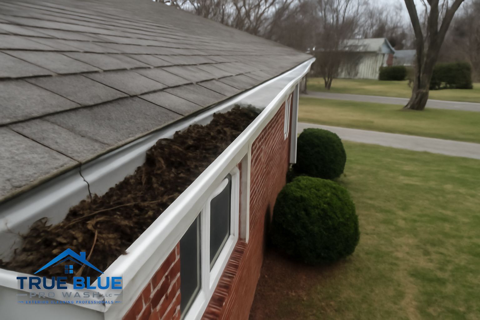 Gutter hanger and downspout inspection on a Wilmington DE home during cleaning visit