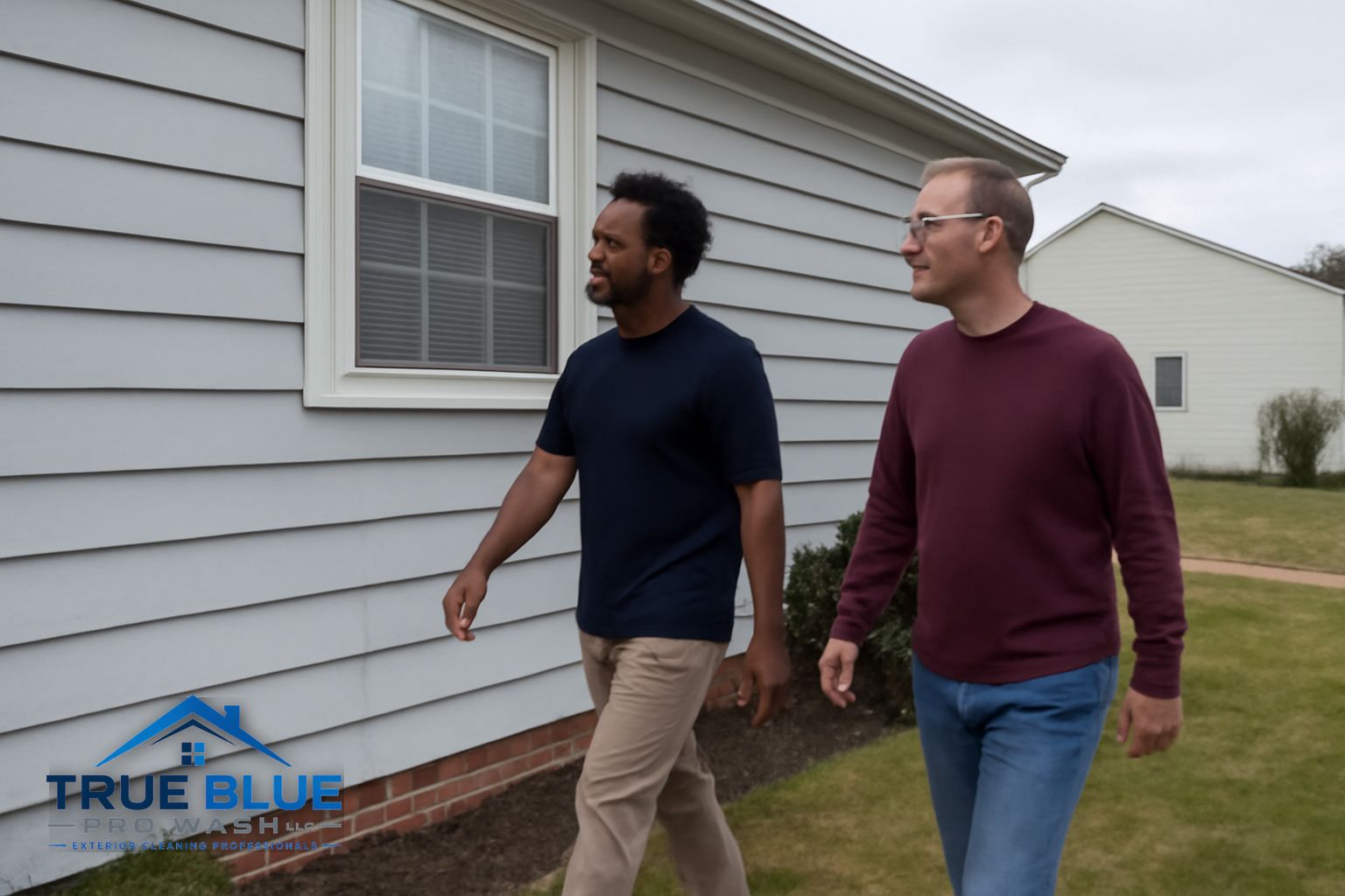 Technician applying soft wash solution to siding on a New Castle County Delaware home