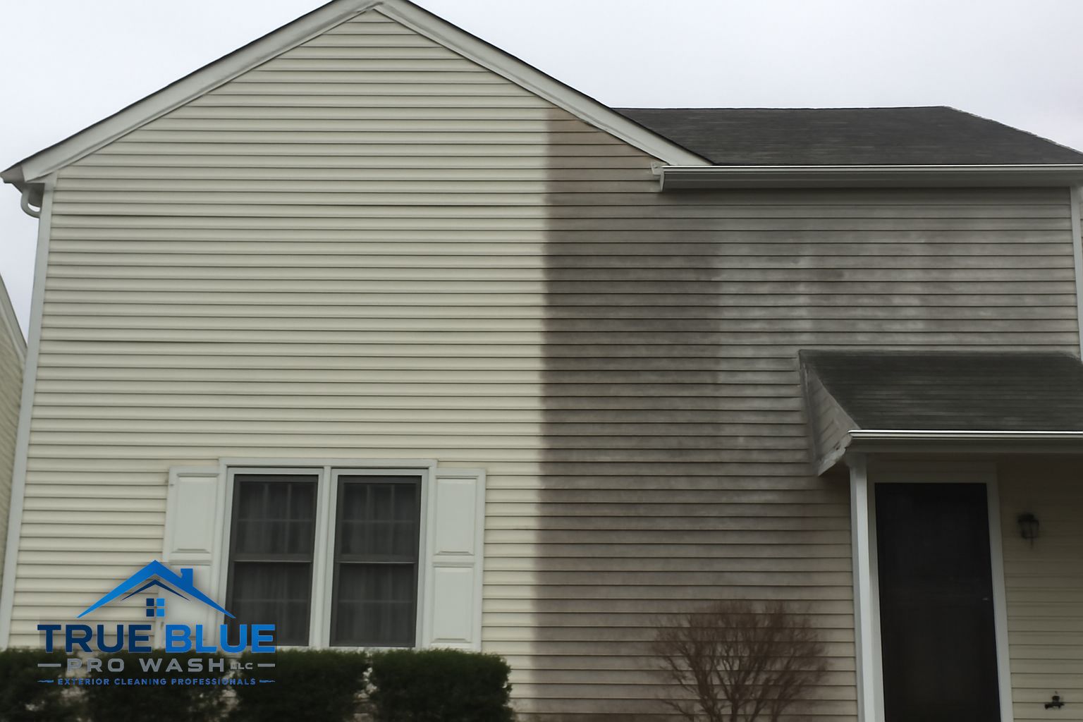 Before and after soft washing on a two-story home exterior in Newark Delaware