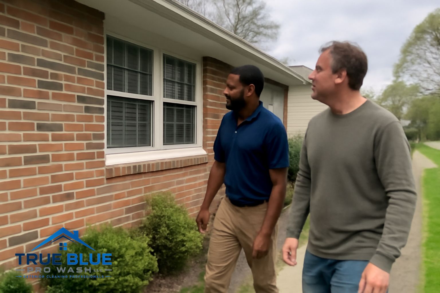 True Blue Pro Wash technician soft washing a two-story home exterior in West Chester PA
