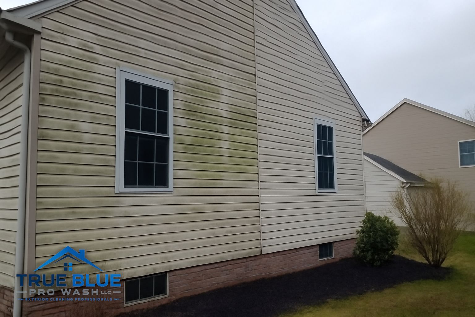 Crew cleaning gutters and washing the exterior of a home in West Chester PA during a bundled service visit