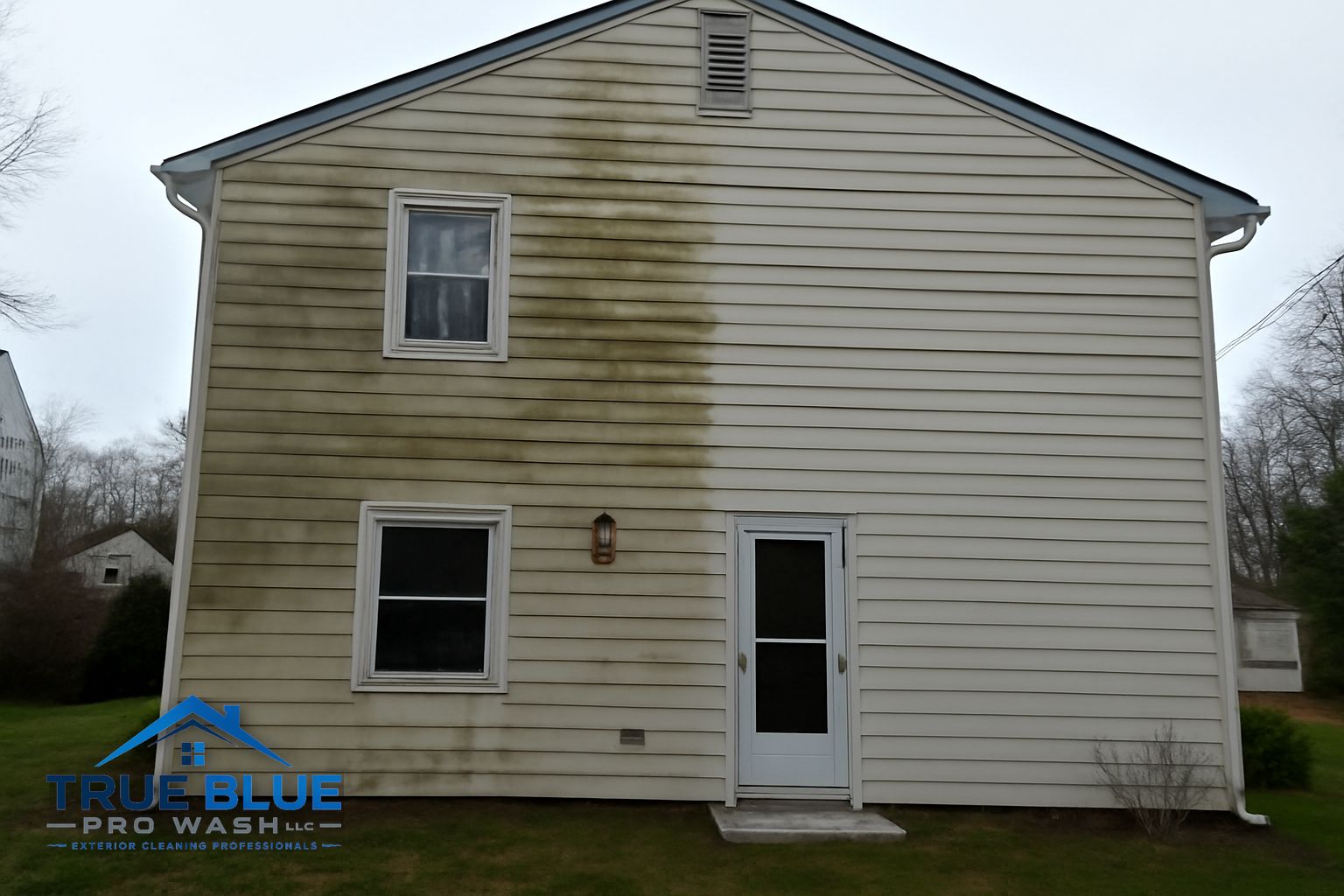 Soft washing a two-story colonial home in Wilmington's Highlands neighborhood