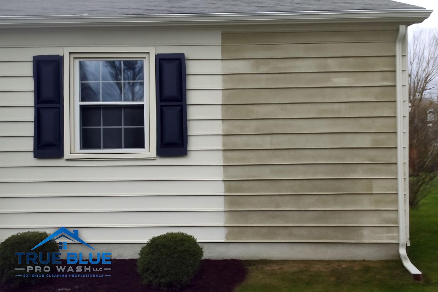 True Blue Pro Wash technician rinsing siding on a Westover Hills home in Wilmington DE