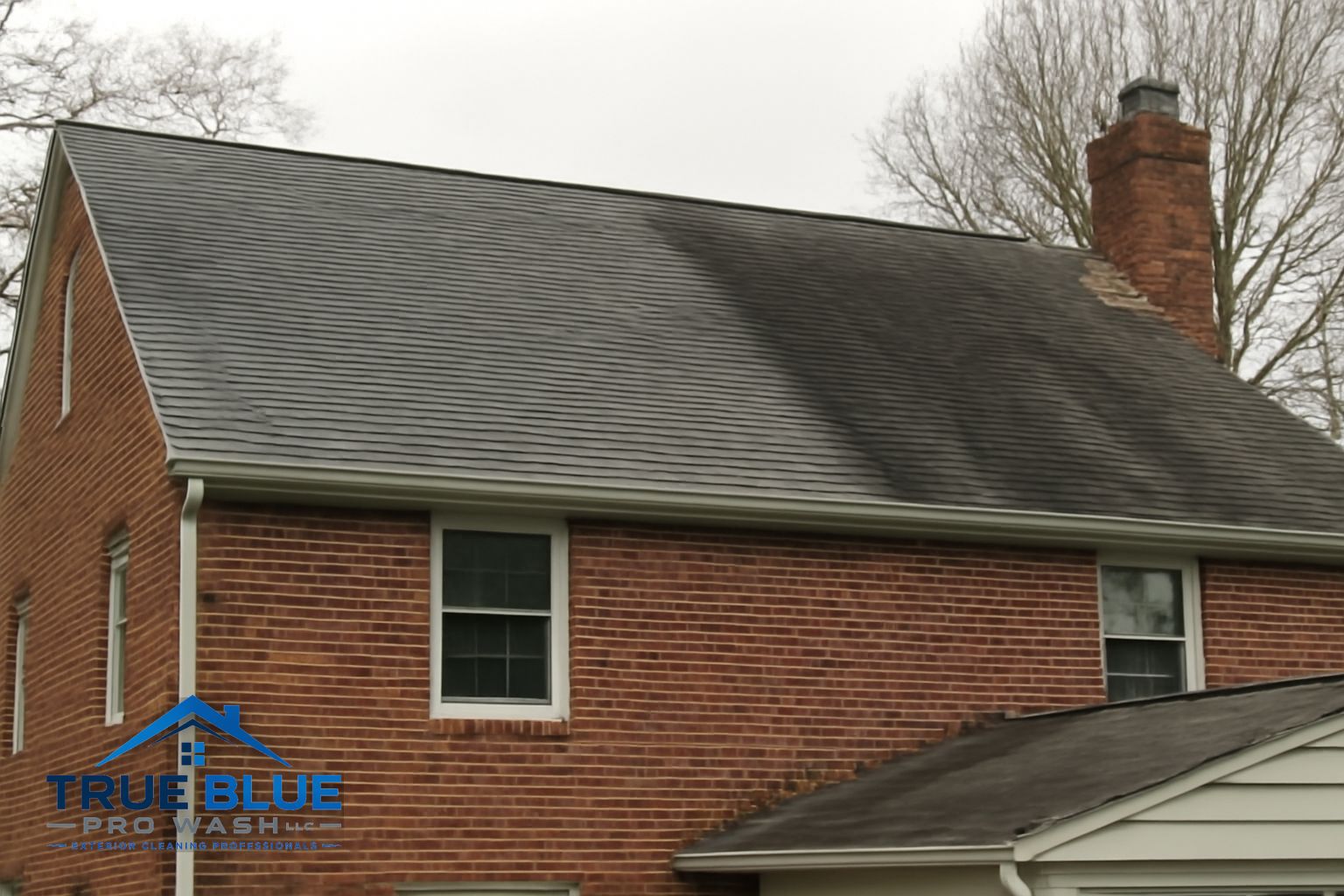 Clean asphalt shingle roof after soft washing in a Wilmington Delaware neighborhood