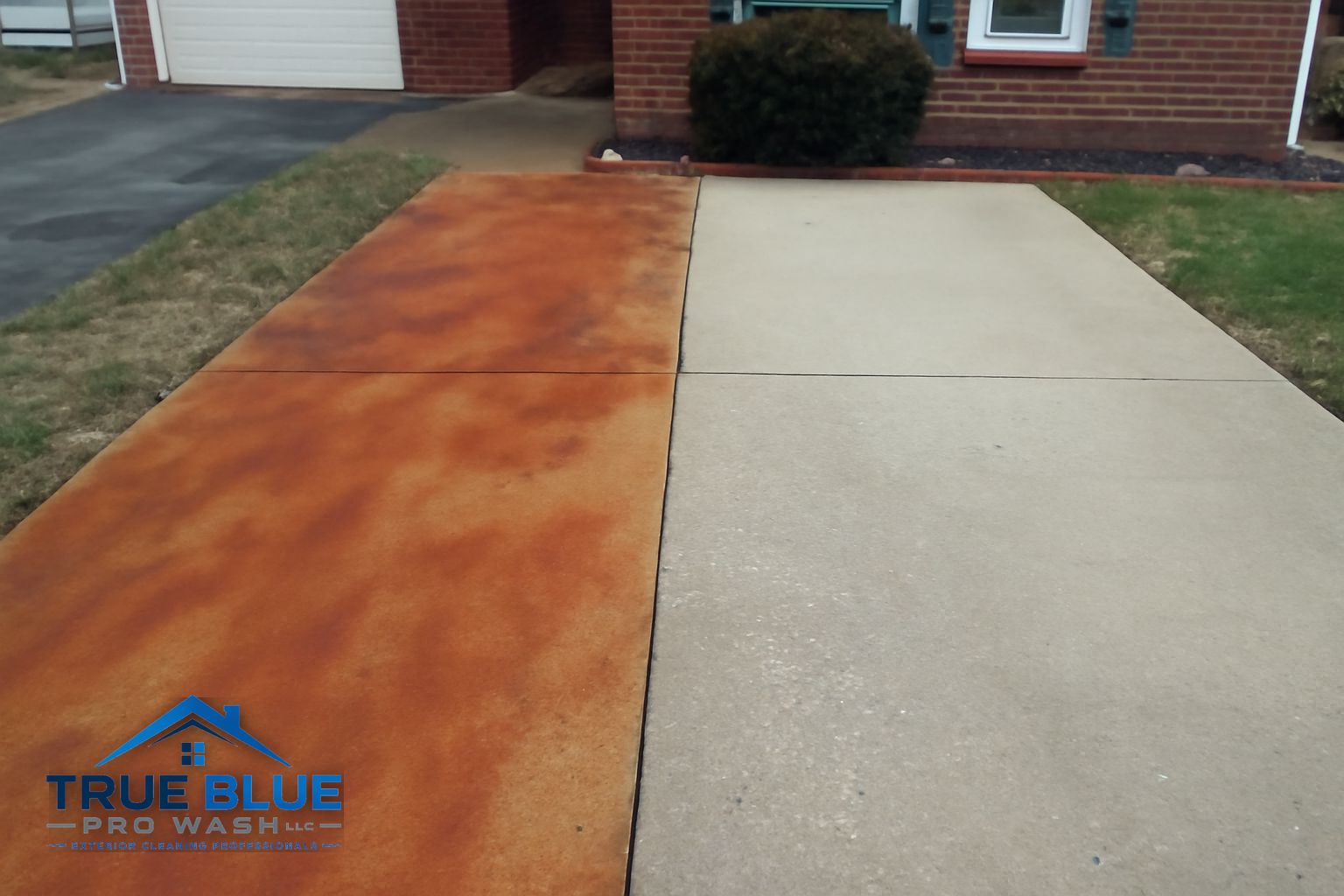 Clean concrete driveway after rust and oxidation stain removal by True Blue Pro Wash in Chadds Ford PA