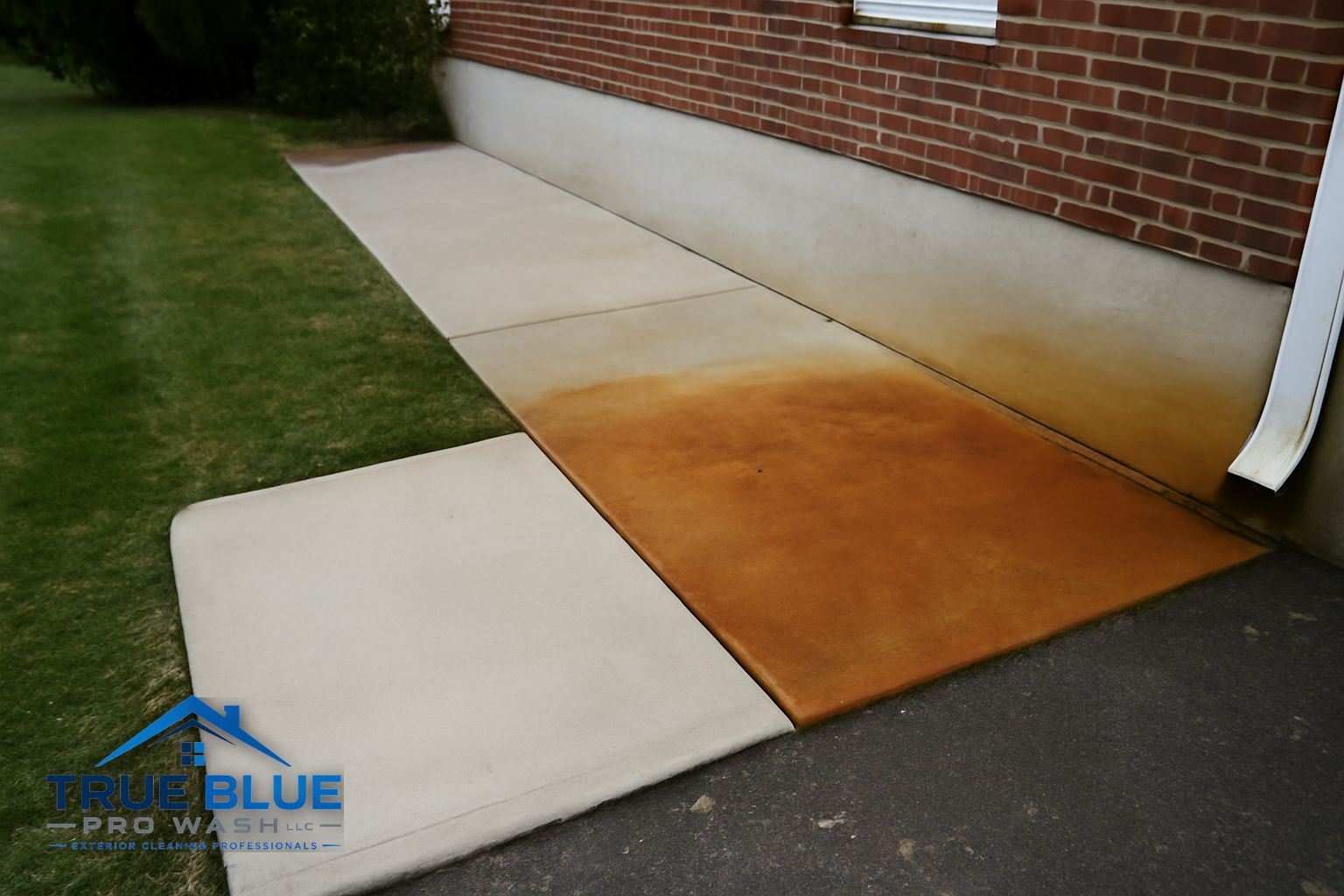 Clean concrete driveway after rust stain removal in Newark Delaware