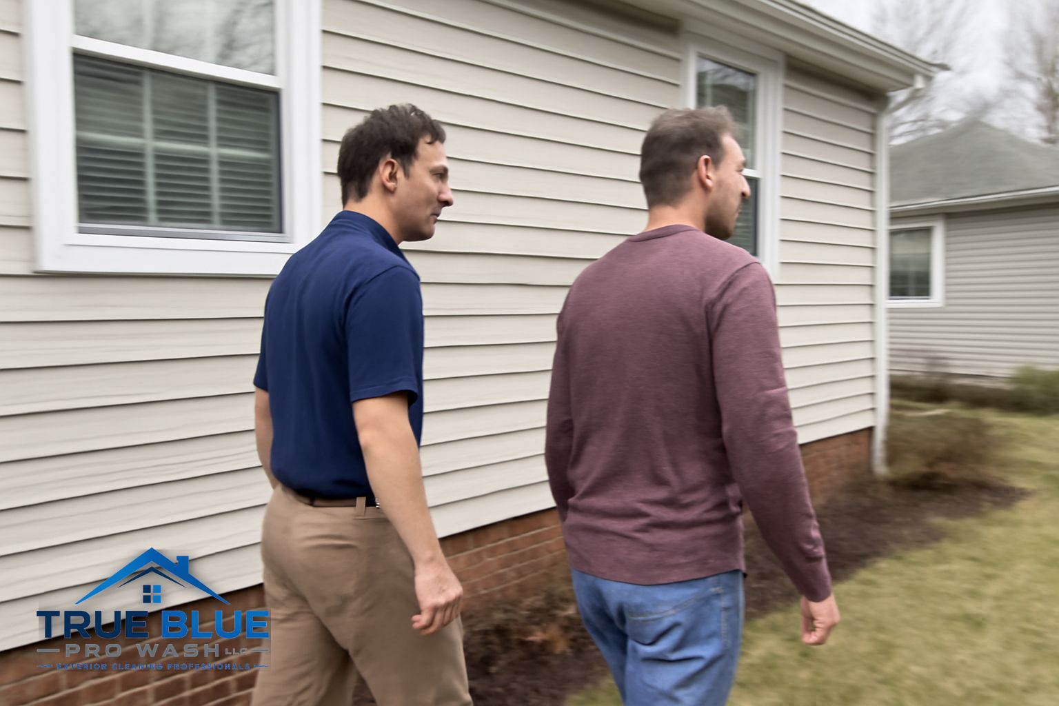 Aluminum gutters with black oxidation tiger stripe stains on a Salem County NJ home before brightening