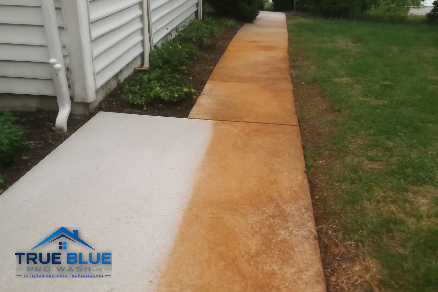 Clean sealed concrete driveway after rust stain removal in West Chester PA
