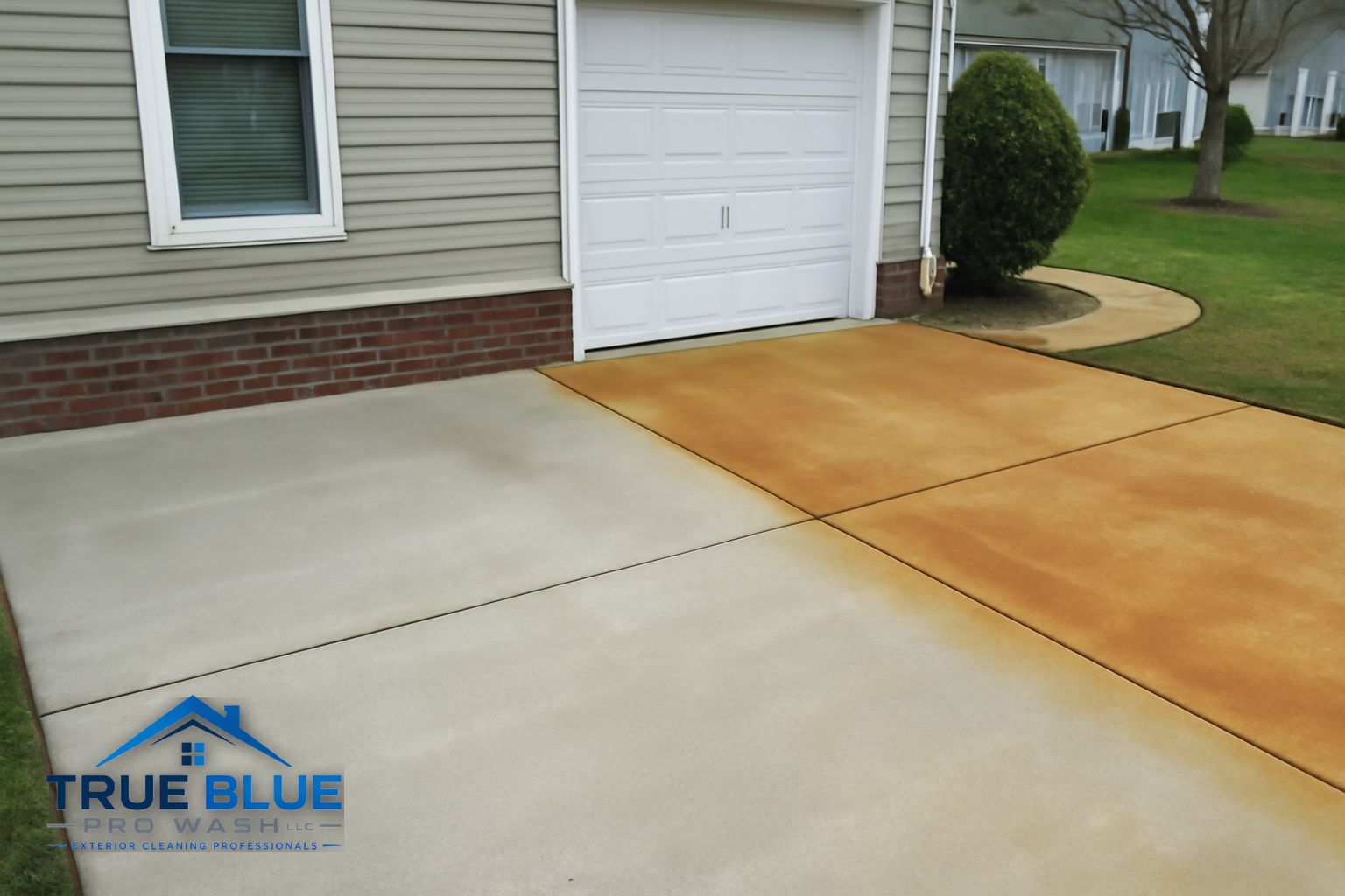 Pressure washing technician treating a rust stained concrete surface at a Wilmington Delaware home