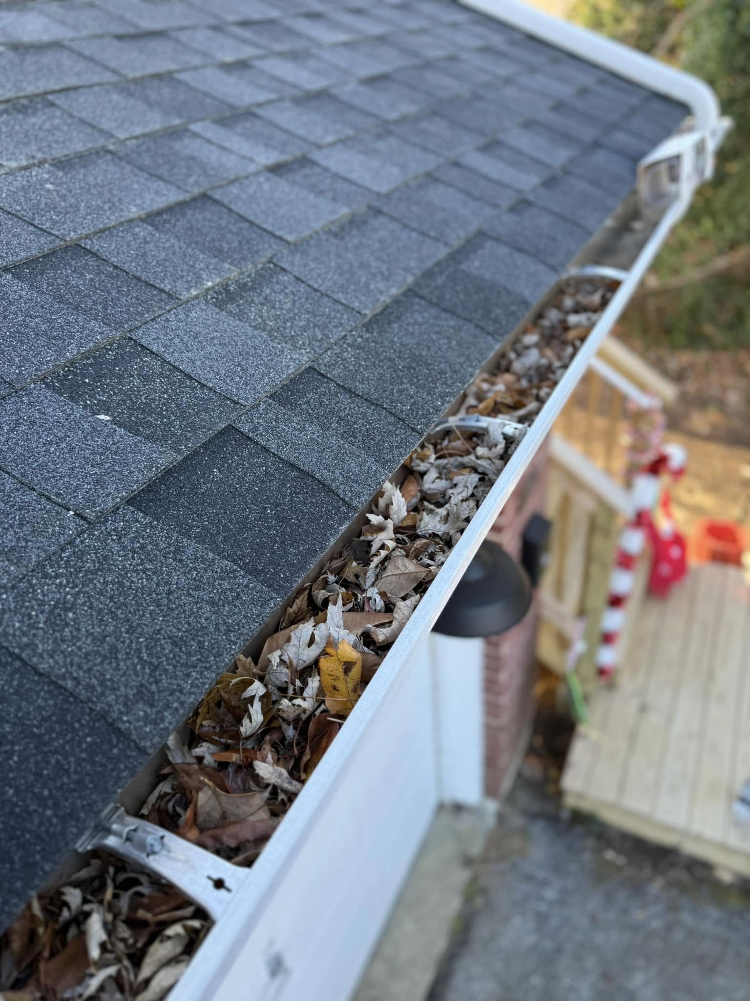 Clearing leaves and debris from a Middletown DE gutter